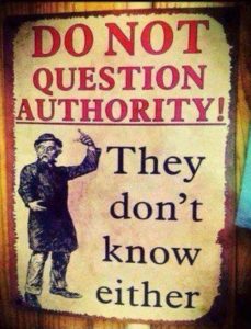 A sign that says "Do not question authority! They don't know either."