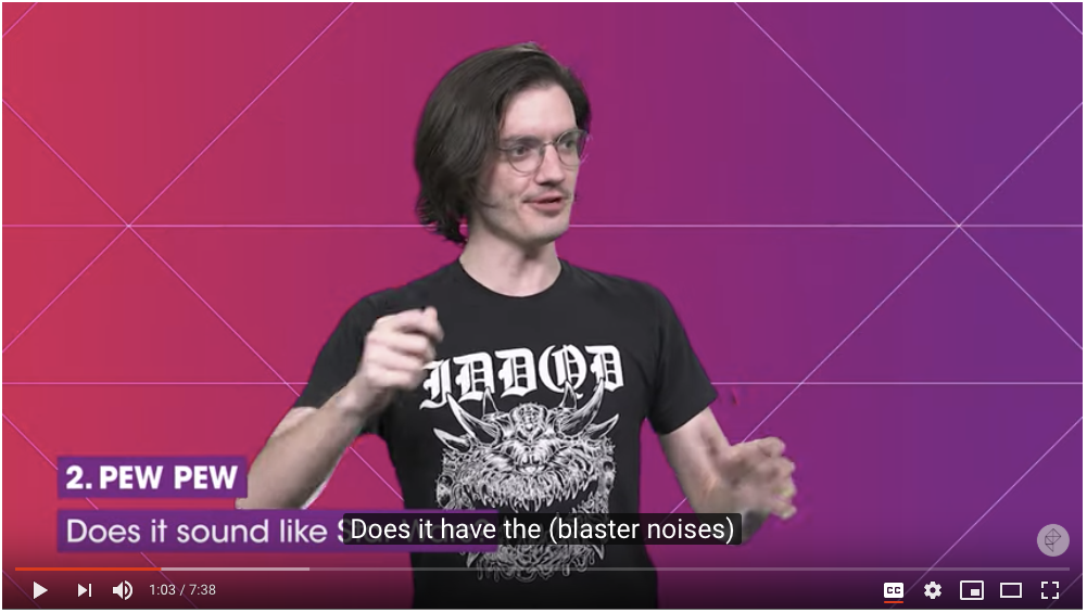 Screenshot of a video with captions reading Does it have the (blaster noises) overlaying text that reads 2. PEW PEW Does it sound like - additional text is covered.