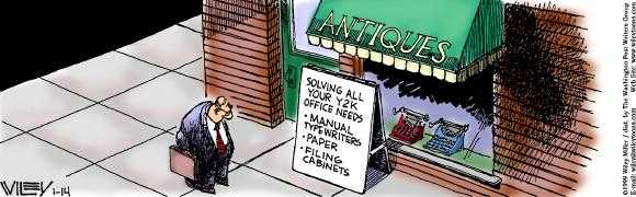 A business man standing outside an antique shop looking at an a frame sign that says solving all your y2k office needs. manual typewriters. paper. filing cabinets.